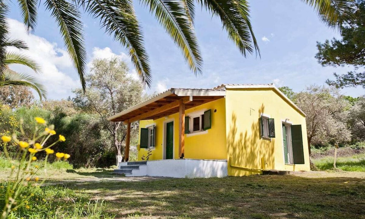 Almiros Beach House | Cute yellow Handmade House with tree garden