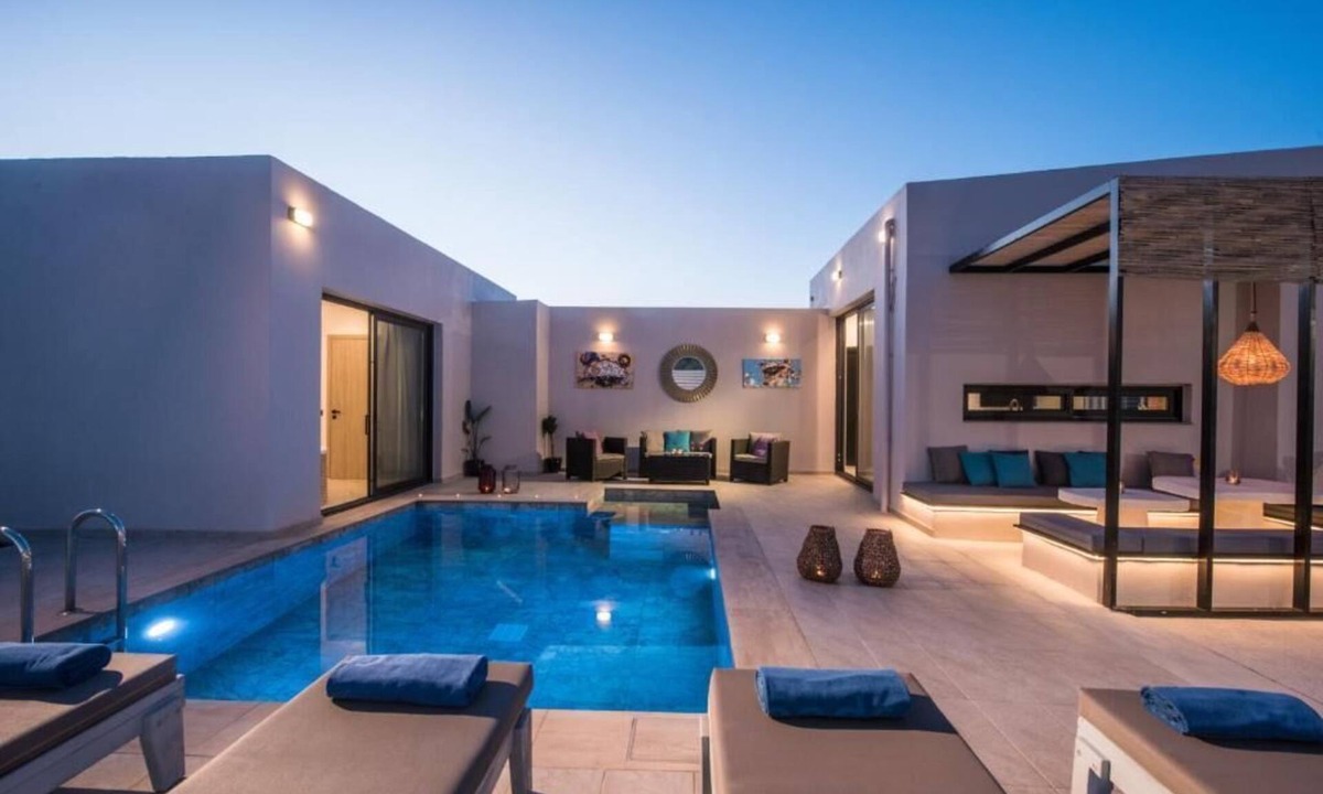 Skotino Villa | Villa with a sun terrace, garden, and a seasonal outdoor swimming pool.