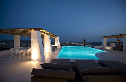 Tourlos Villa | My Rental Homes - Villa Opallia with spacious living and dining areas and a pool