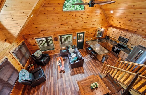 Union Hall Cabin | All Decked Out at Pine Haven — a brand-new lakefront log home on Smith Mountain Lake with a private hot tub, 50+ ft of wraparound deck, fire pit patio & easy lake access. Two full kitchens. One of 5 cabins on an 8-acre lakefront micro-resort.