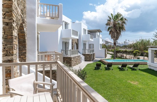 Kionia Apartment | Apartment In A Hotel 'Ninemia Suites Tinos Grand 104' with Shared Pool, Wi-Fi and Air Conditioning