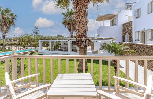 Kionia Apartment | Apartment In A Hotel 'Ninemia Suites Tinos Grand 104' with Shared Pool, Wi-Fi and Air Conditioning