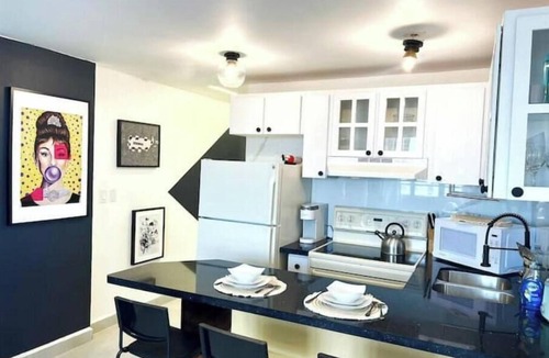 Isla Grande Apartment | Panoramic Sunset View at Modern Chic Condo+Parking