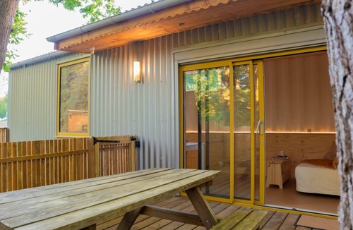 Loupes House | The Mandavi Container - a hot tub under the oak trees
