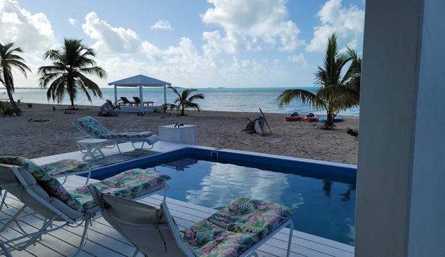 Spectacular beachfront calm water sunset property